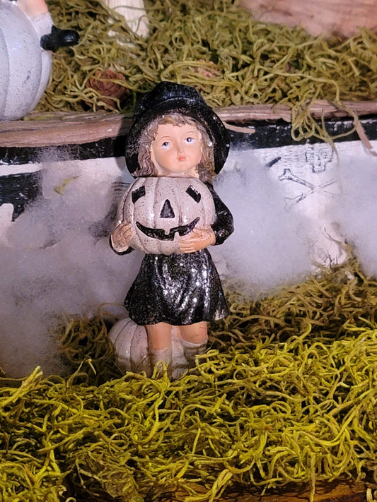 Vintage Halloween Style Glittered Girl in Hat with Pumpkin